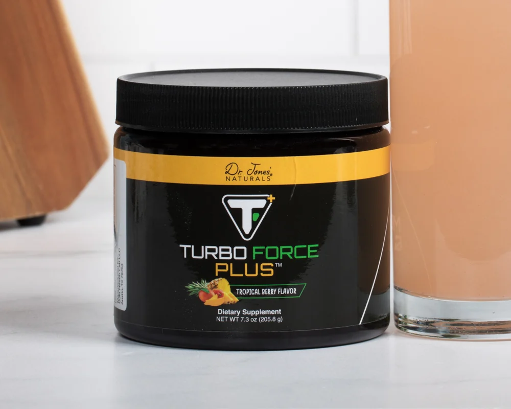 Turbo Force Plus tub next to a glass of the mixed drink on a kitchen counter
